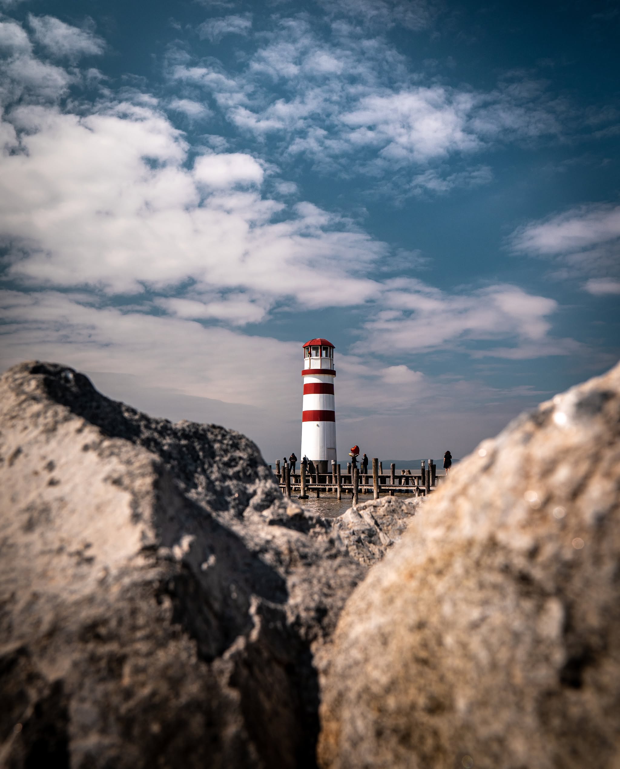 Lighthouse by the water symbolizing guidance and a new start in Austria